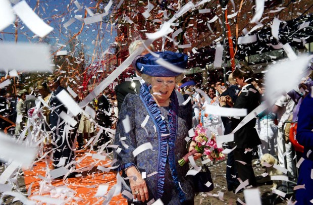 Queen Beatrix of the Netherlands (C) is showered with streamers and confetti during Queen's Day in Veenendaal on April 30, 2012. AFP PHOTO/ANP/ROBIN UTRECHT netherlands out - belgium outROBIN UTRECHT/AFP/GettyImages ORG XMIT: